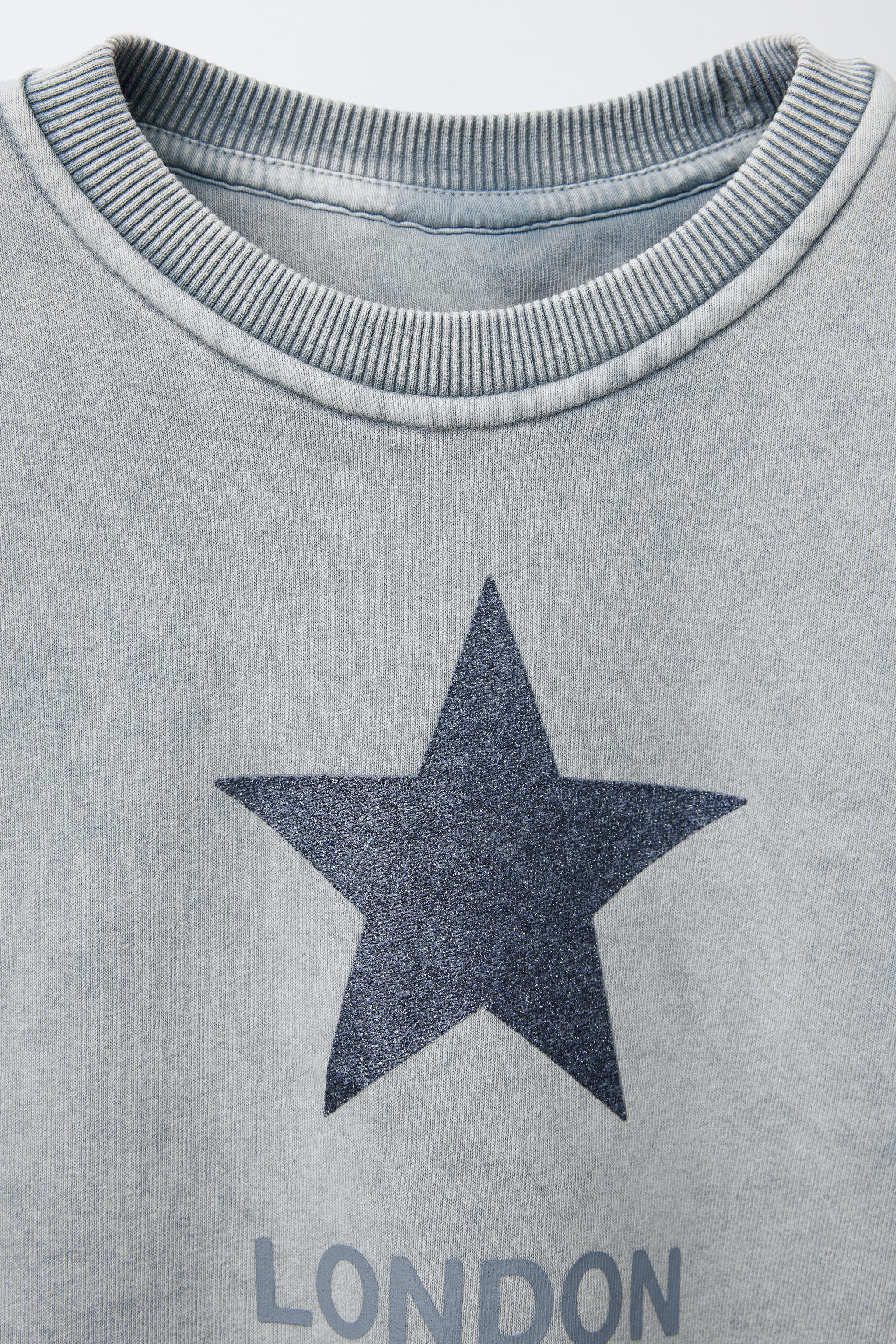 SWEAT EFFET DÉLAVÉ ÉTOILE BRILLANT