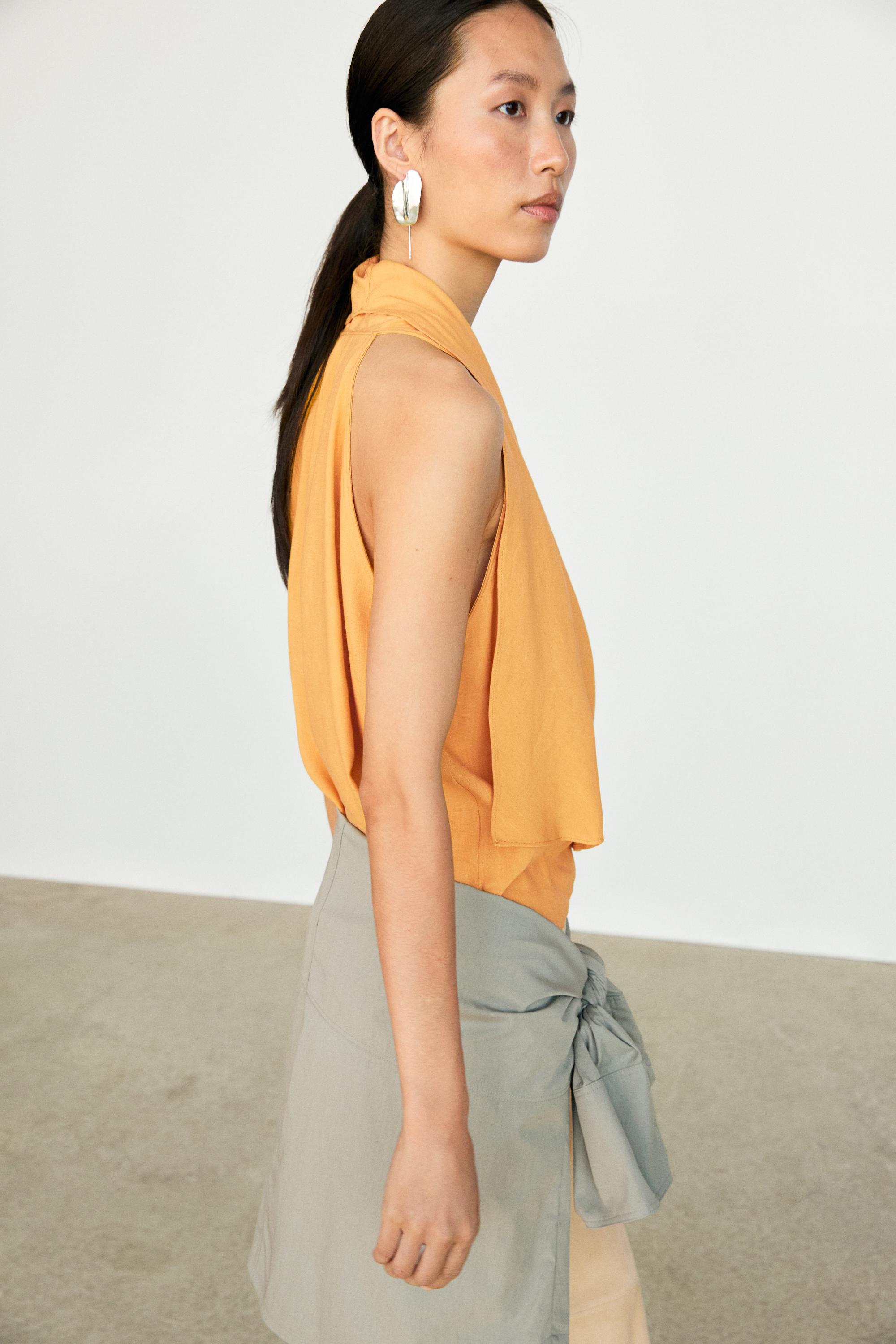 Flowing halter top with ruffle detail