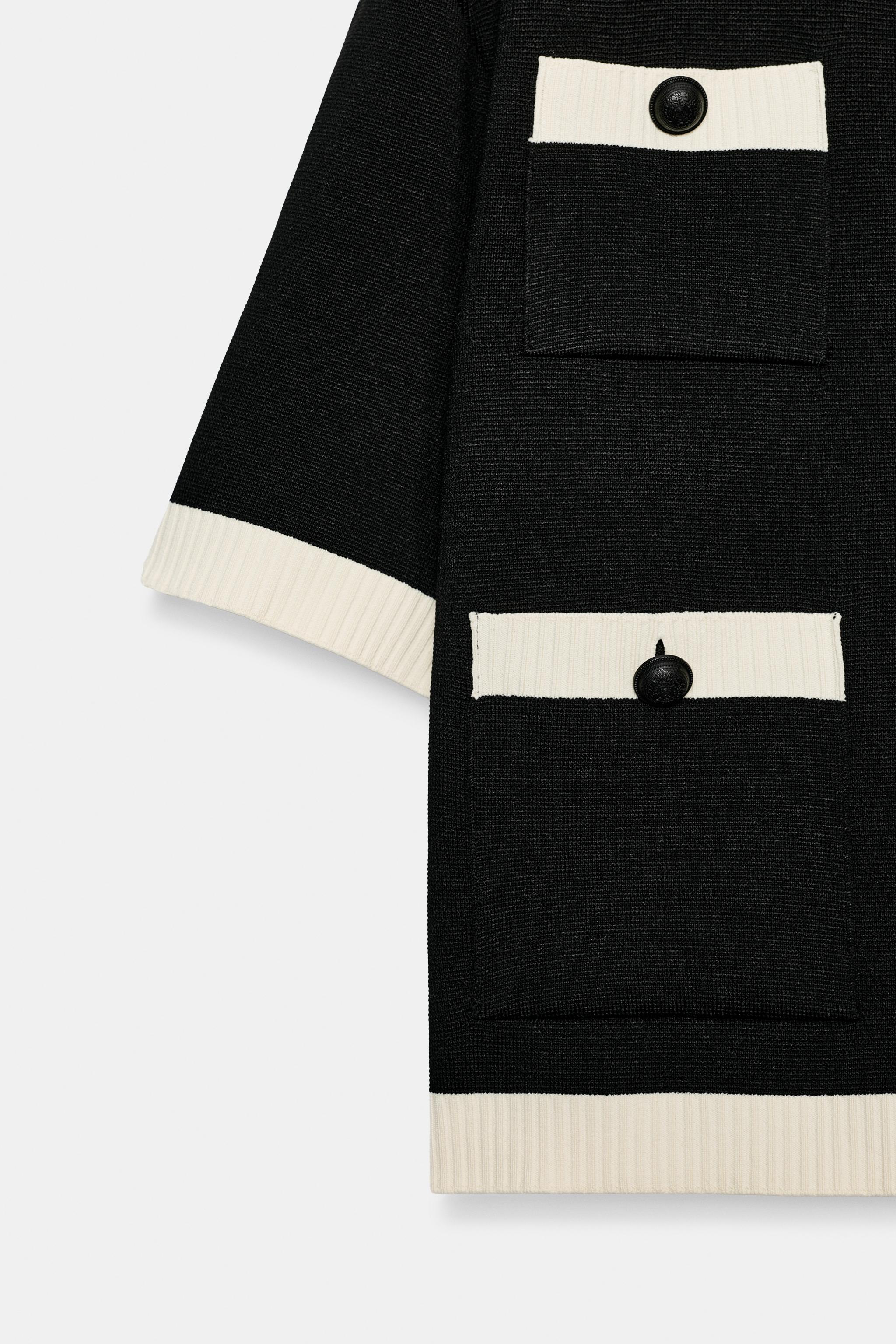 GILET EN MAILLE À MANCHES COURTES ET POCHES