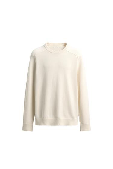Front view of jersey, round neck, long sleeves, ribbed trim.