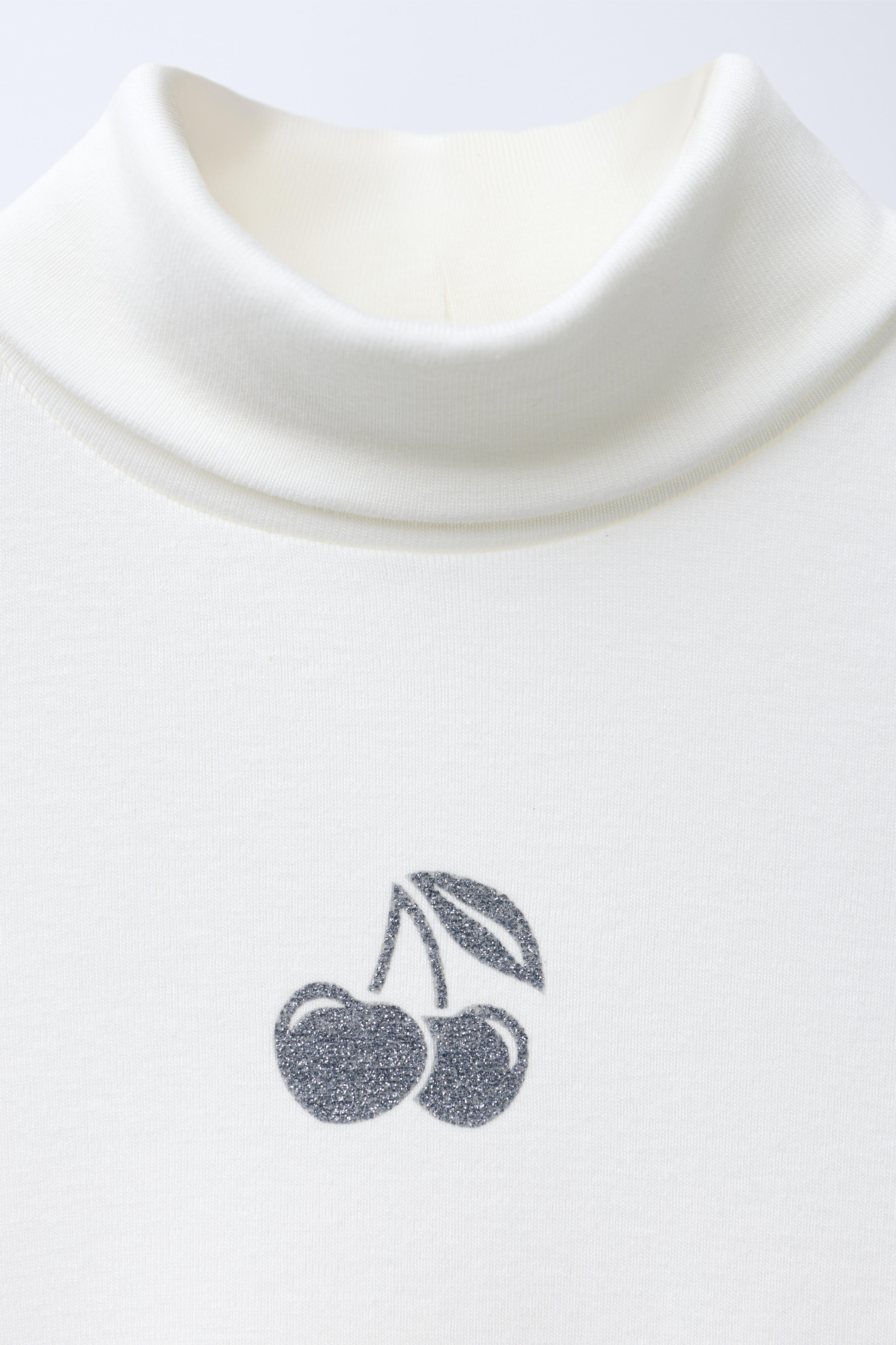 HAUT À COL ROULÉ CUT OUT