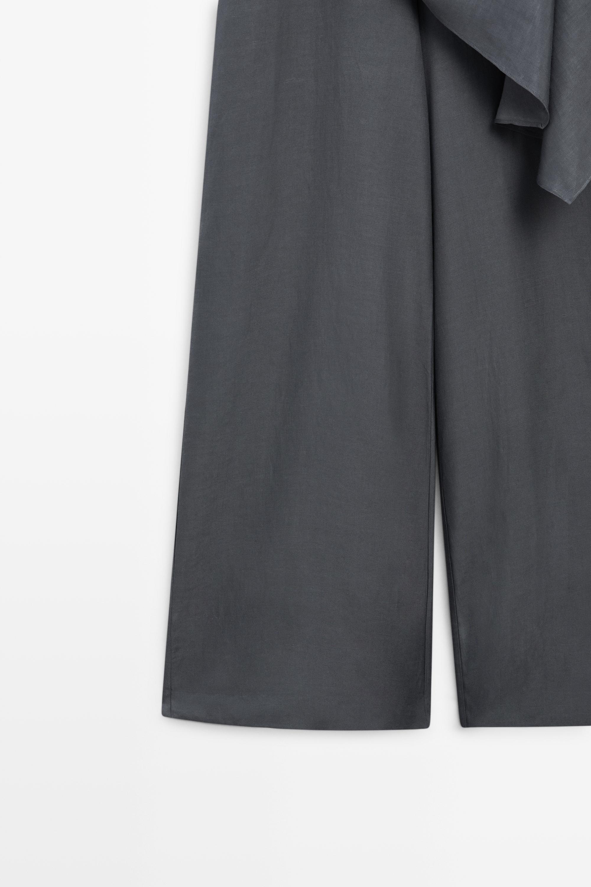 Asymmetric draped jumpsuit