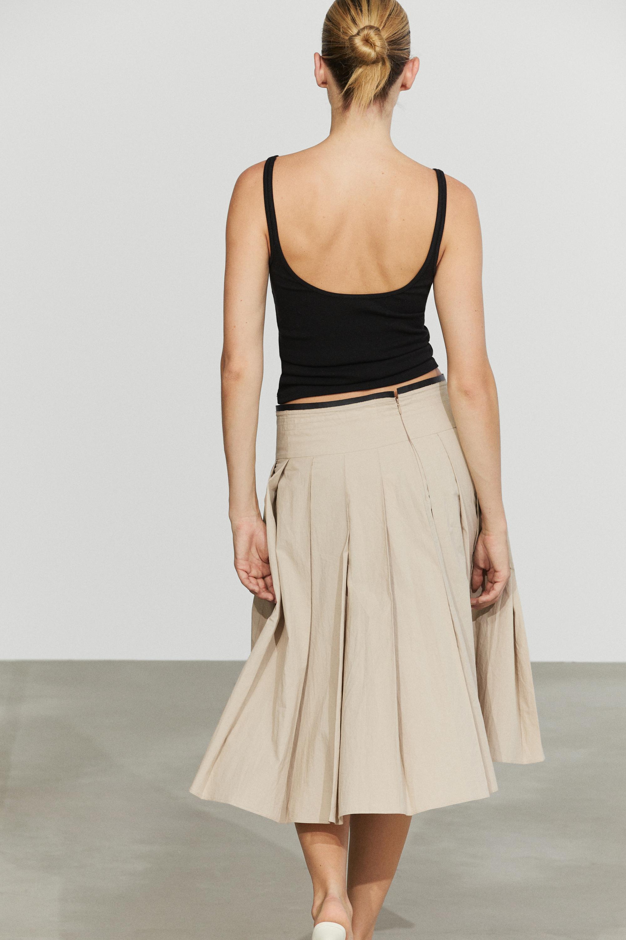 Pleated midi skirt with contrasting sash