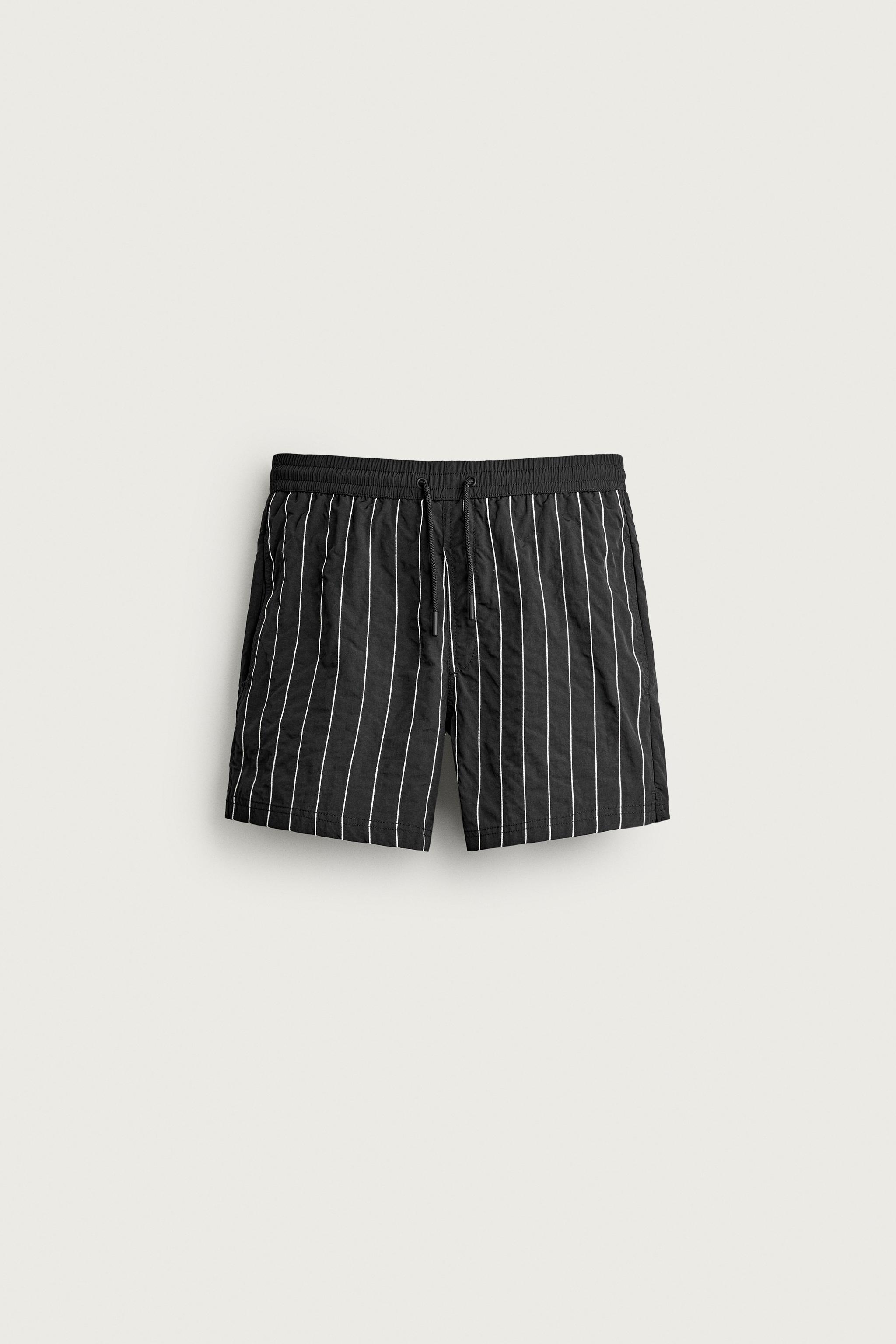 EMBROIDERED STRIPE MID-LENGTH SWIM TRUNKS — Black