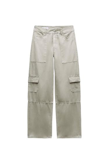 Beige cargo trousers with large pockets and visible stitching, presented on a white background.