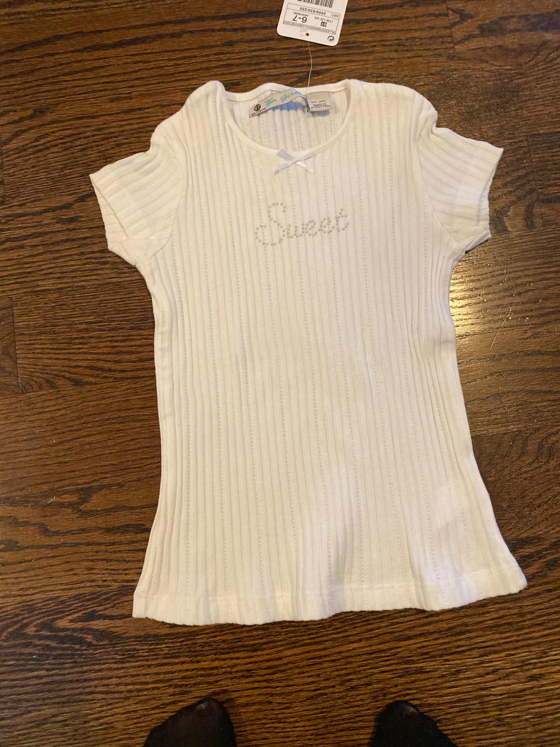 Front view of a white ribbed t-shirt with 'Sweet' text on the chest.