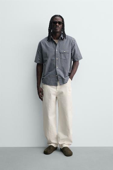 PANTALONS FUSTER RELAXED FIT - Blanc trencat de Zara - Imatge 0