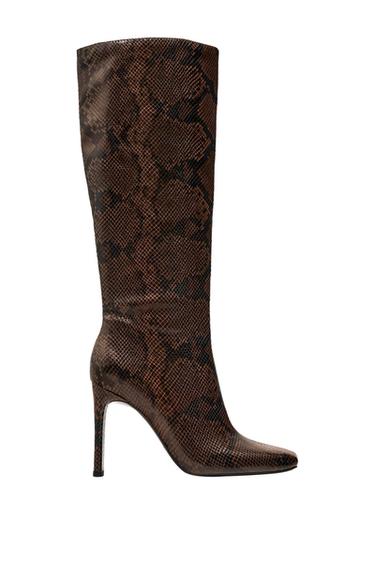 High boot with a thin heel and snake print in brown and black tones, side view on a white background.