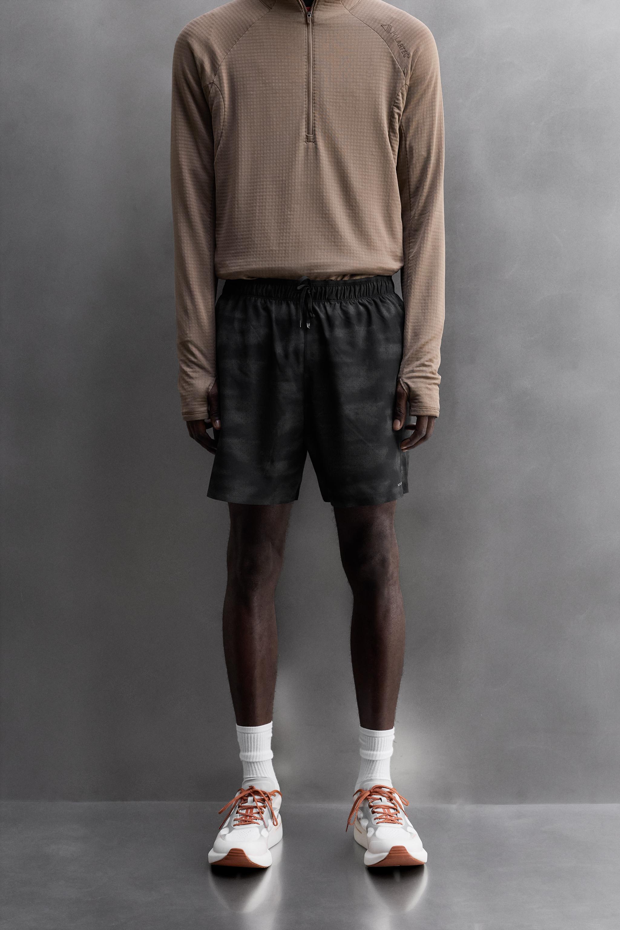 PERFORATED RUNNING SHORTS