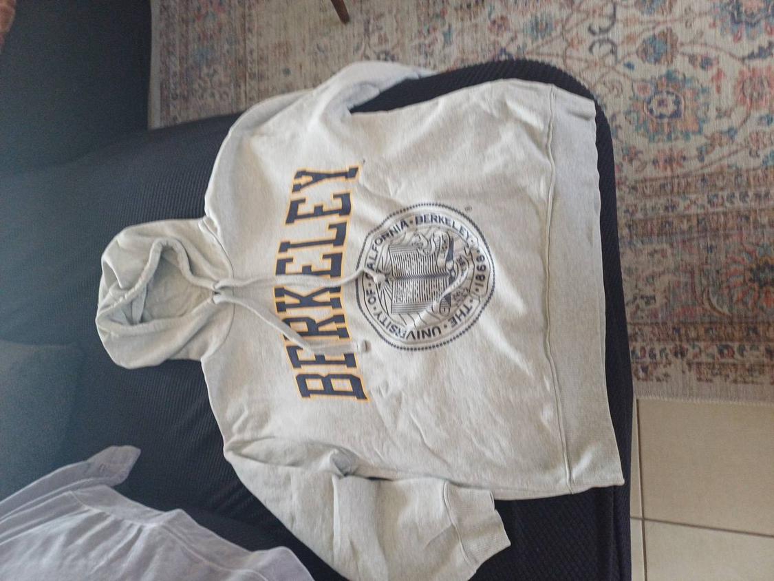 Grey hooded sweatshirt with "BERKELEY" text in large letters. University of California crest in the centre.