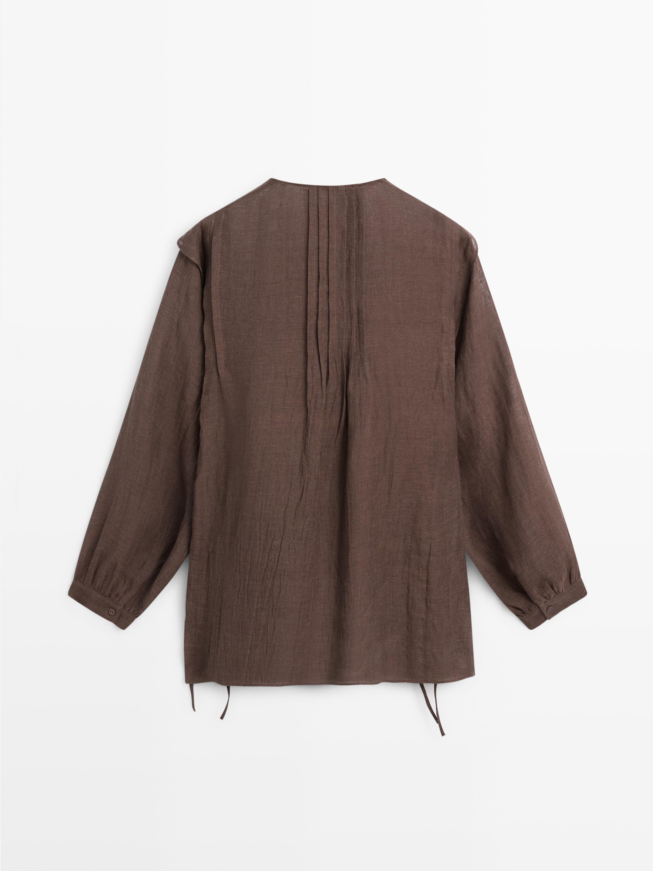 Flowing oversize linen blouse with ruffles