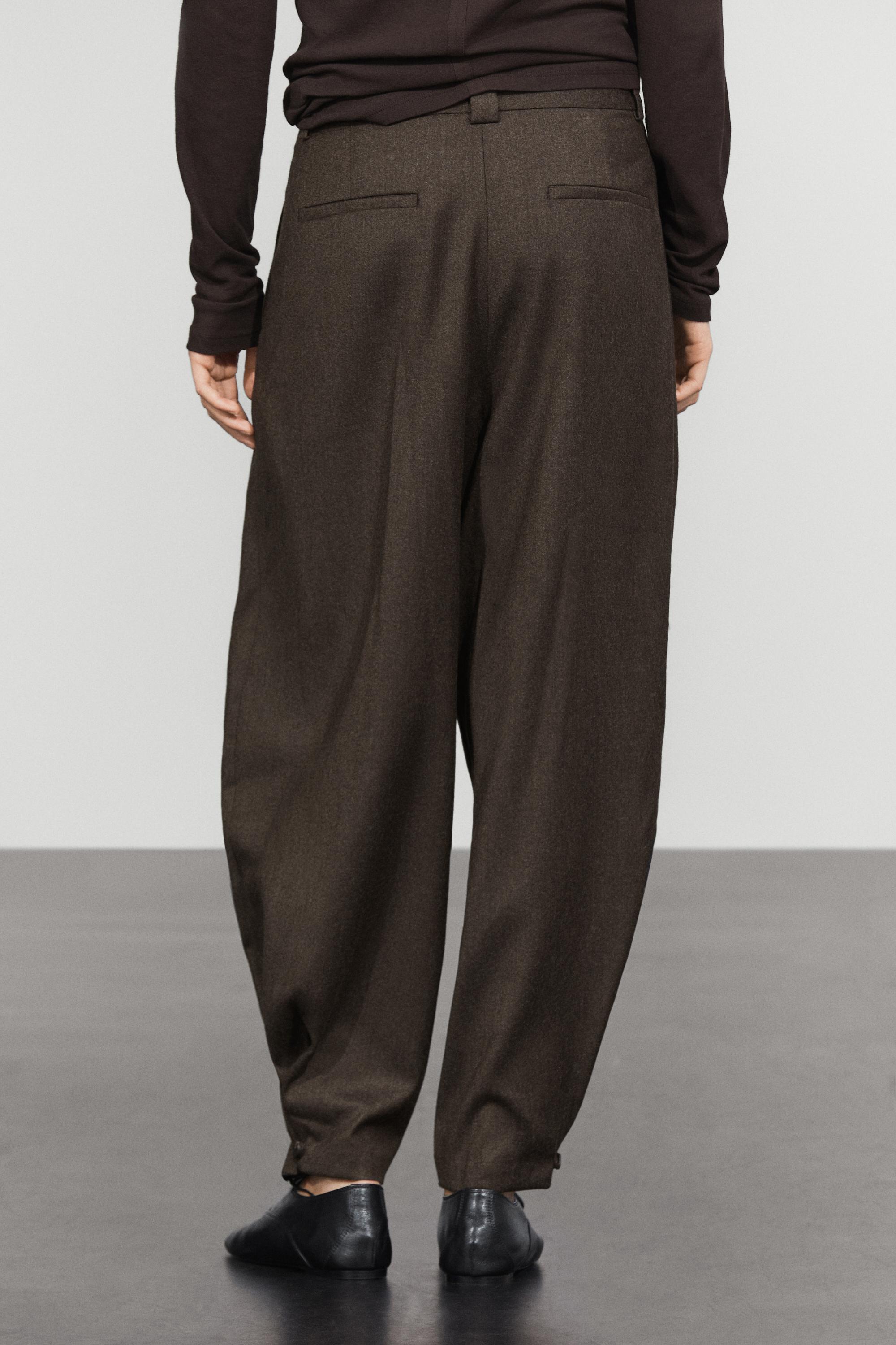 Pleated flannel trousers with hem detail