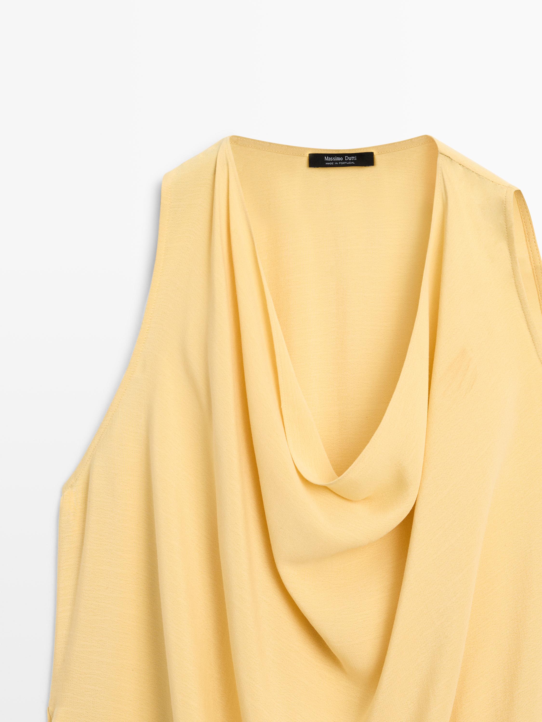 Long flowing asymmetric top