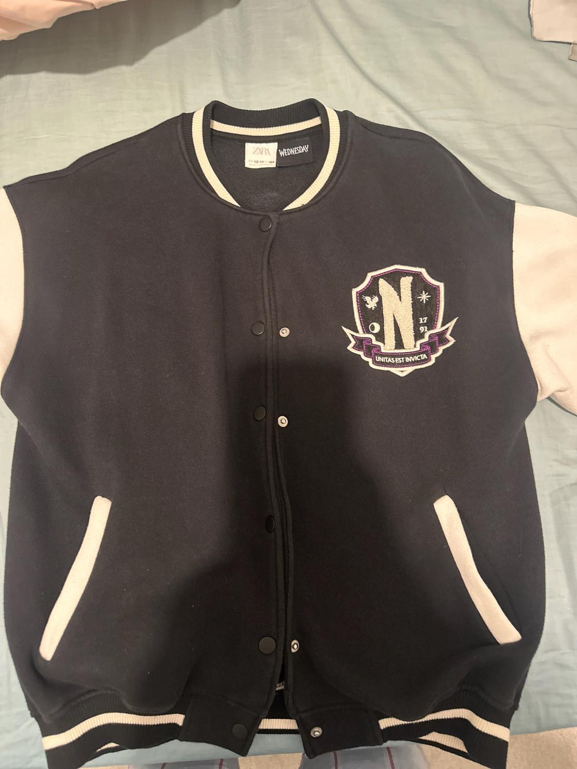 Navy blue and white jacket. Patch featuring "N", "17 91" and "UNITAS EST INVICTA". Label with "ZARA WEDNESDAY" text.
