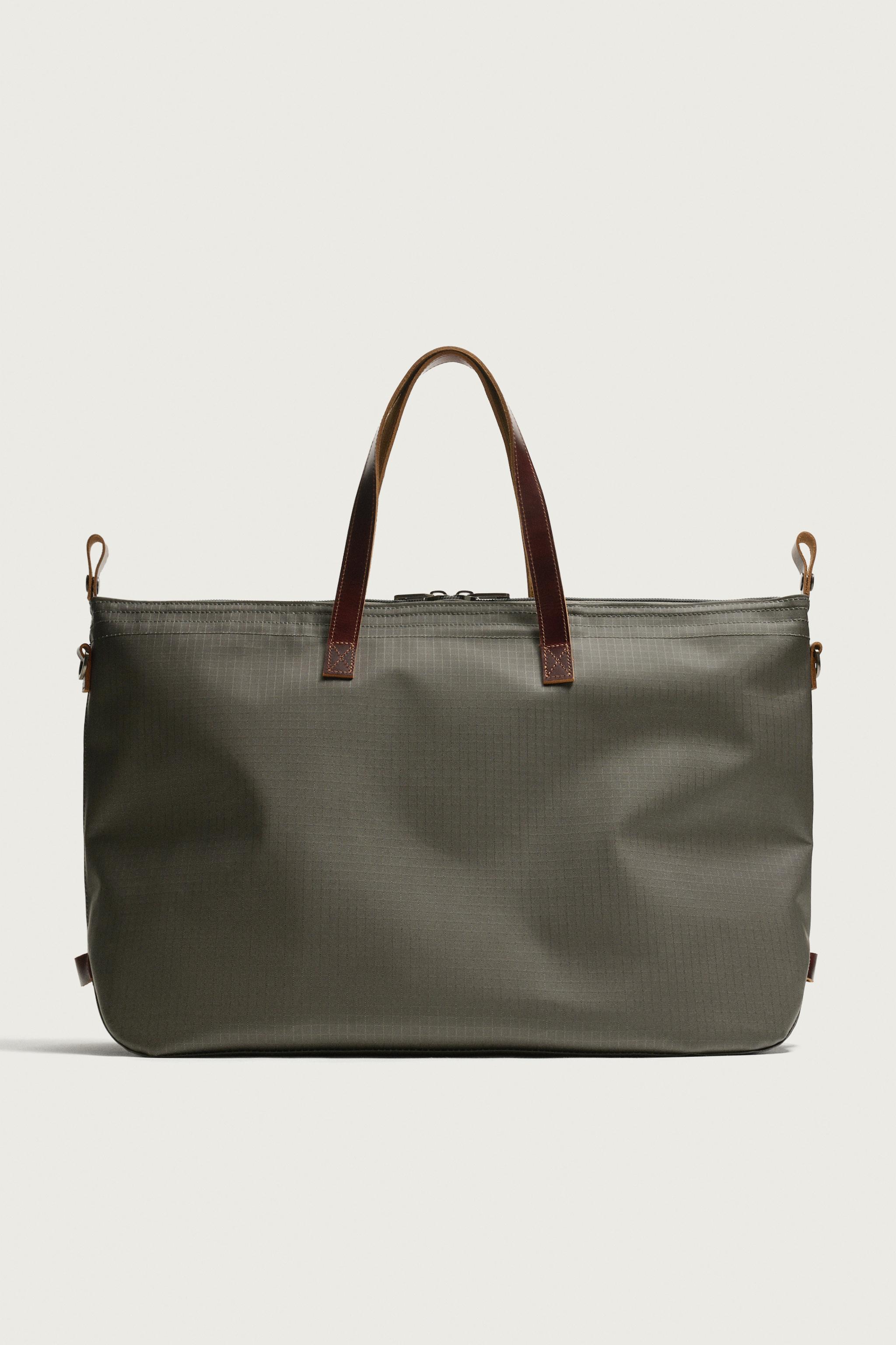 LEATHER-DETAIL TRAVEL BAG
