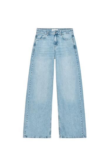Front view of blue jeans with wide legs and front and back pockets.