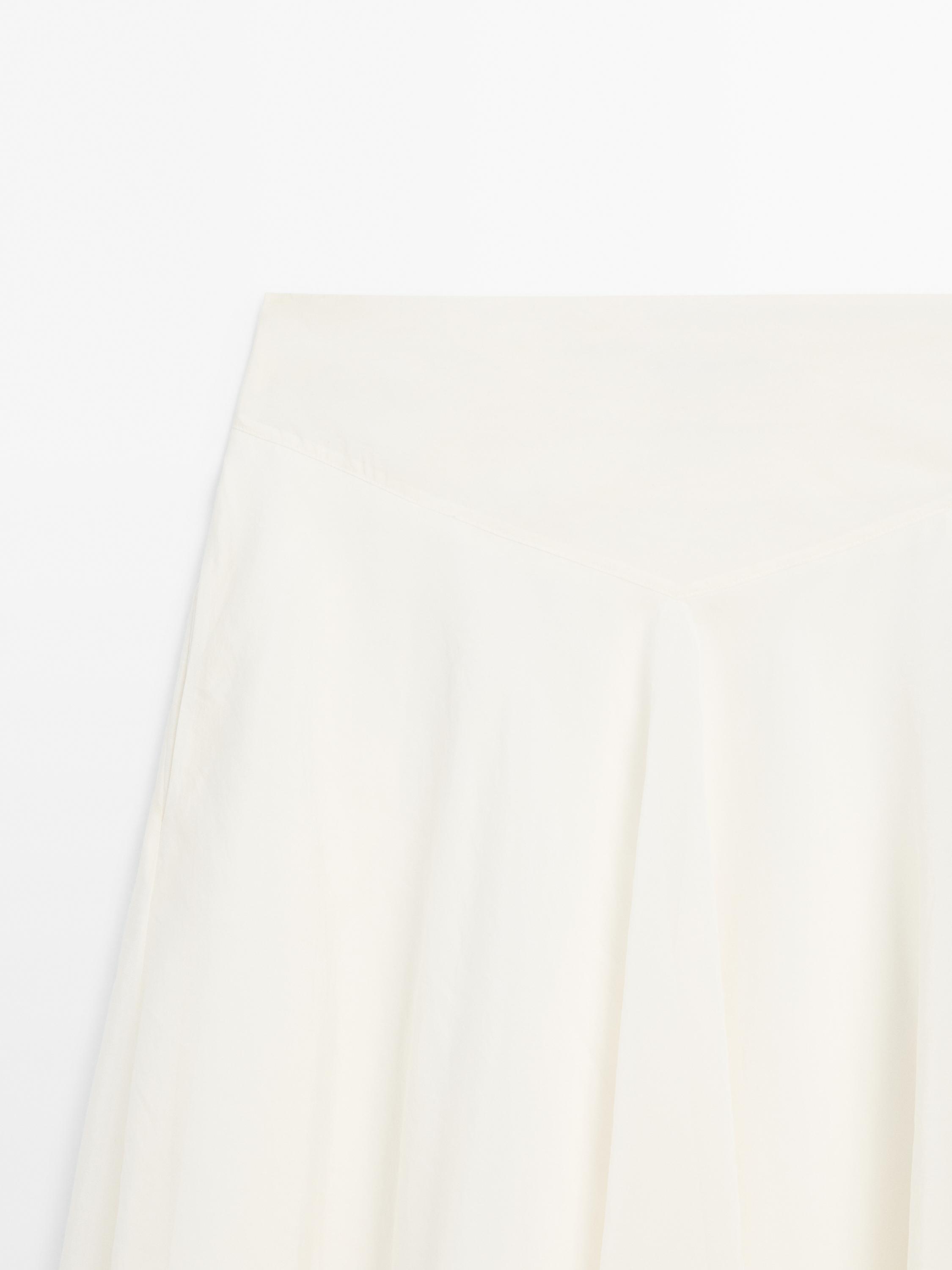Jupe midi ample en maille côtelée