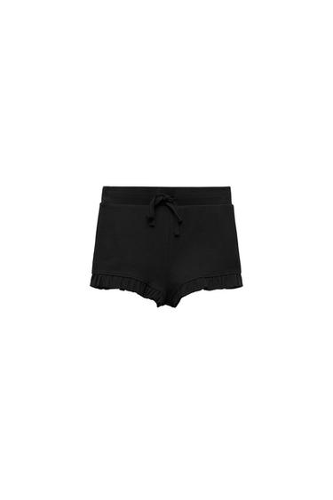 SHORTS WITH RUFFLED HEMS