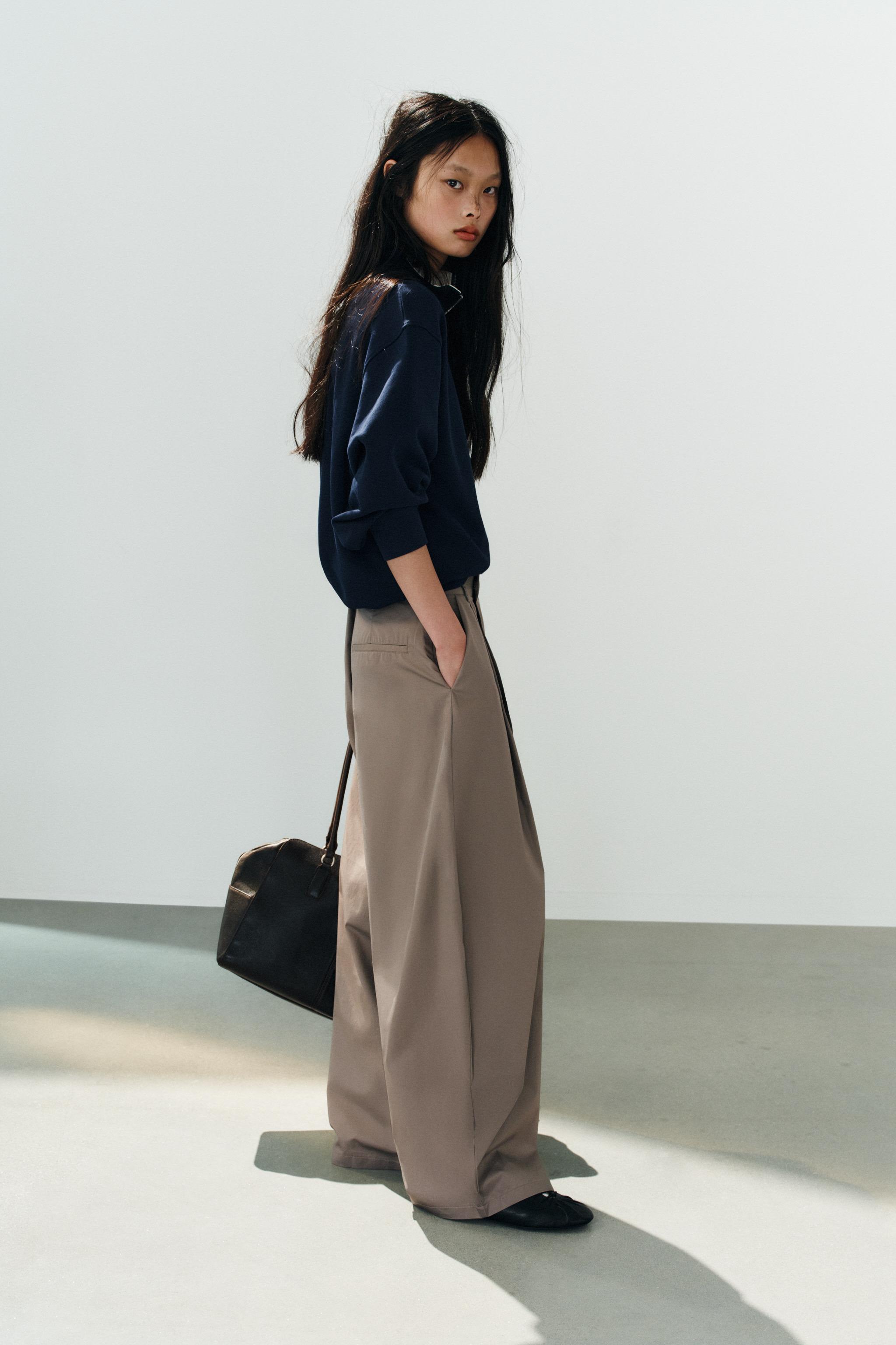 ASYMMETRIC WAIST PLEATED TROUSERS