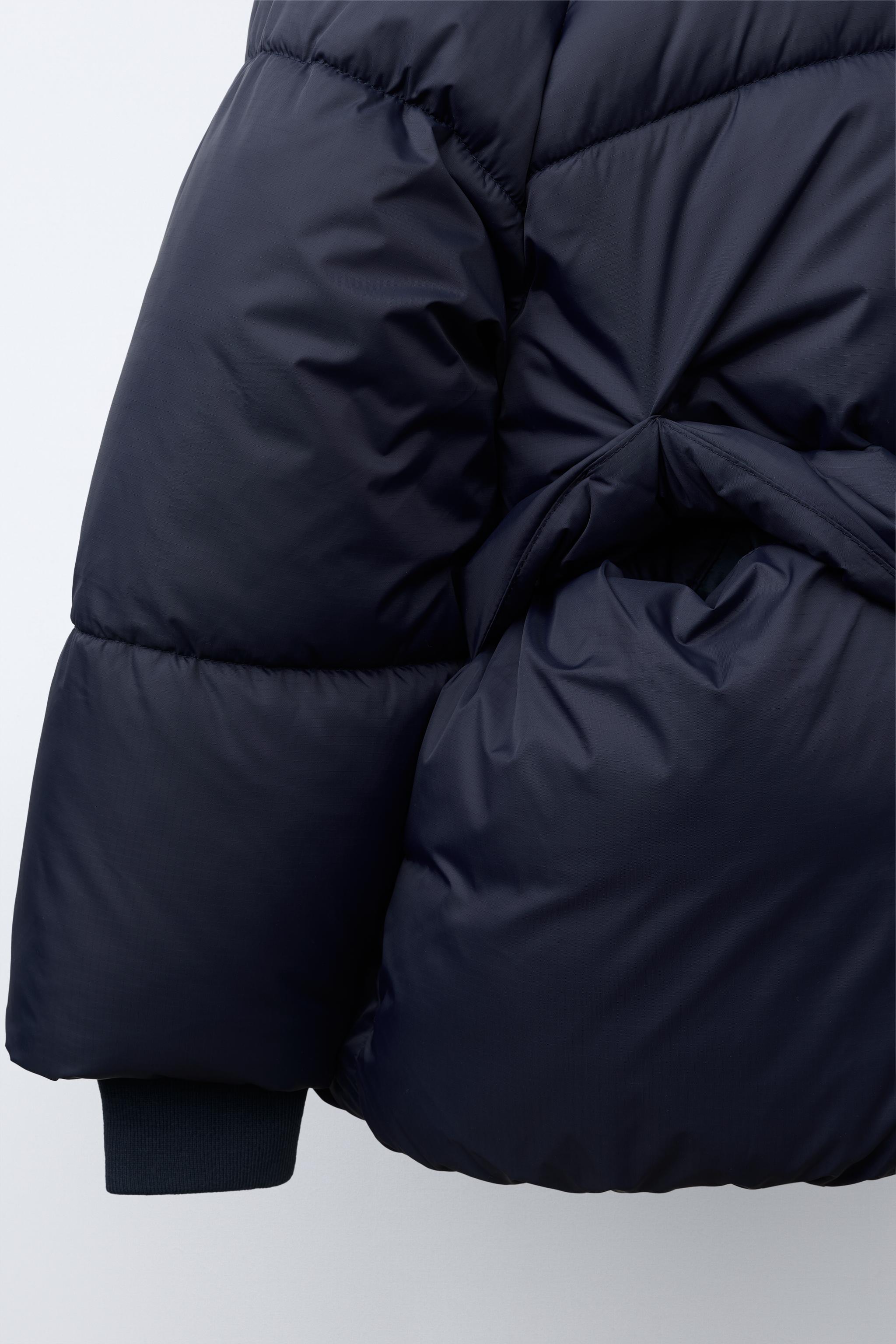 MANTEAU MATELASSÉ À CAPUCHE DÉPERLANT