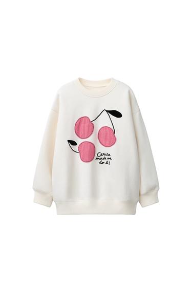 PULOVER Z NAŠITKI ČEŠENJ - Ekru barva od Zare