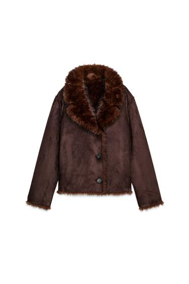 Front view of a dark brown jacket with a faux fur lapel collar, long sleeves and a double-breasted button fastening.