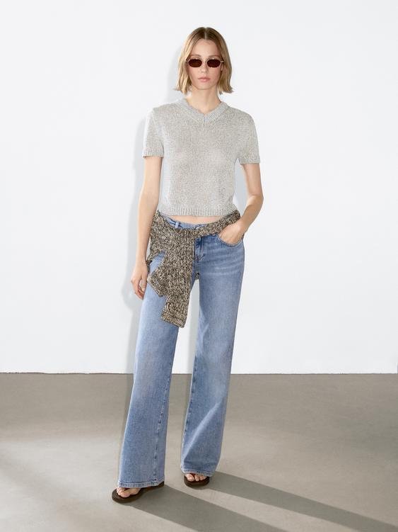 Knit sweater with fabric detail