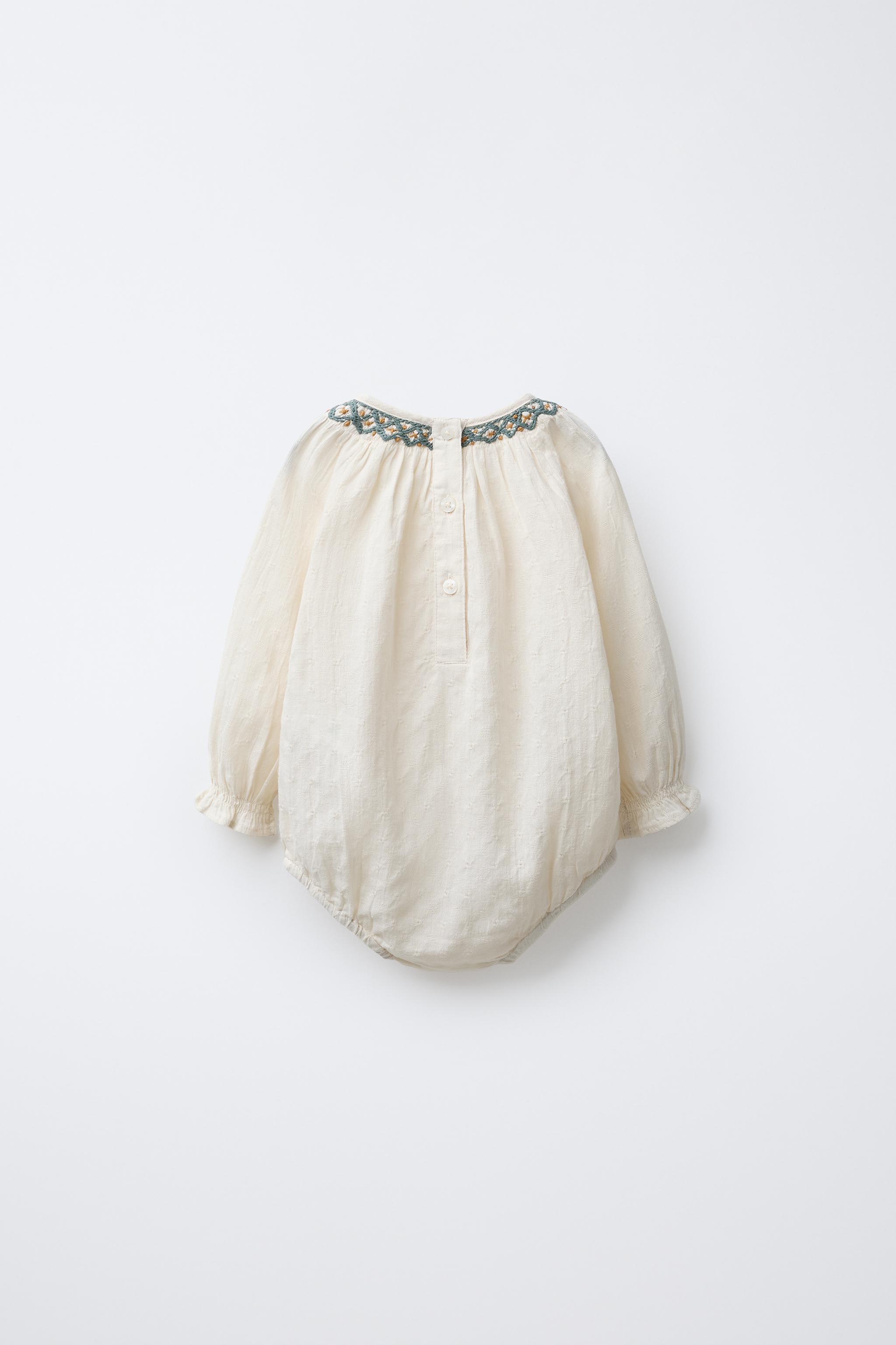 CONTRAST EMBROIDERED BODYSUIT