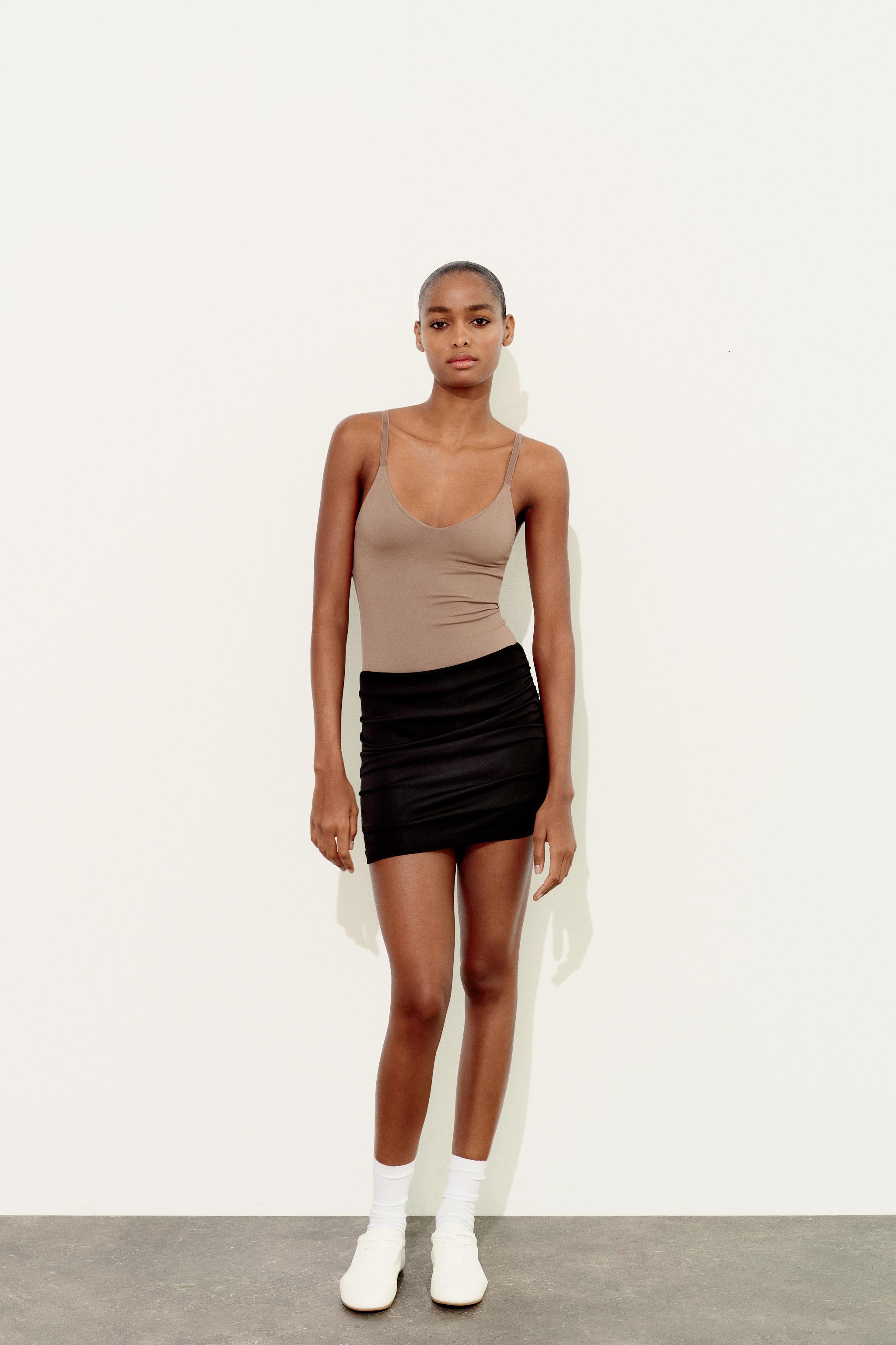 Black Stretch Mini Skirt Smooth on the Front and With 4 Pleats on the Back,  With Integrated Shorts. -  Canada
