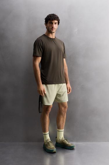 LIGHTWEIGHT PERFORATED SHORTS - Grey green by Zara