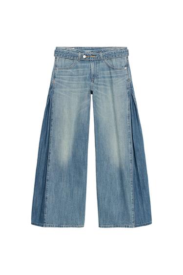 Front view of light blue wide-leg jeans with front and back pockets, button and zip fastening.