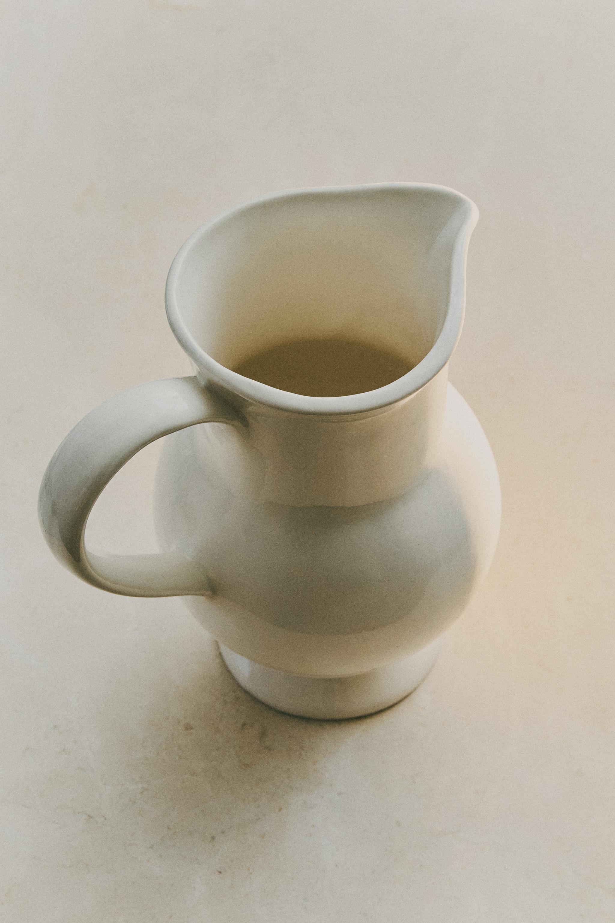 CREAM DECORATIVE CERAMIC PITCHER