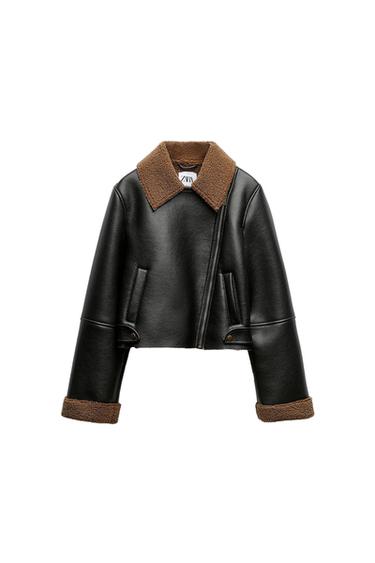 Black jacket with a brown collar and cuffs. Asymmetric front zip fastening and side pockets. Visible Zara label.