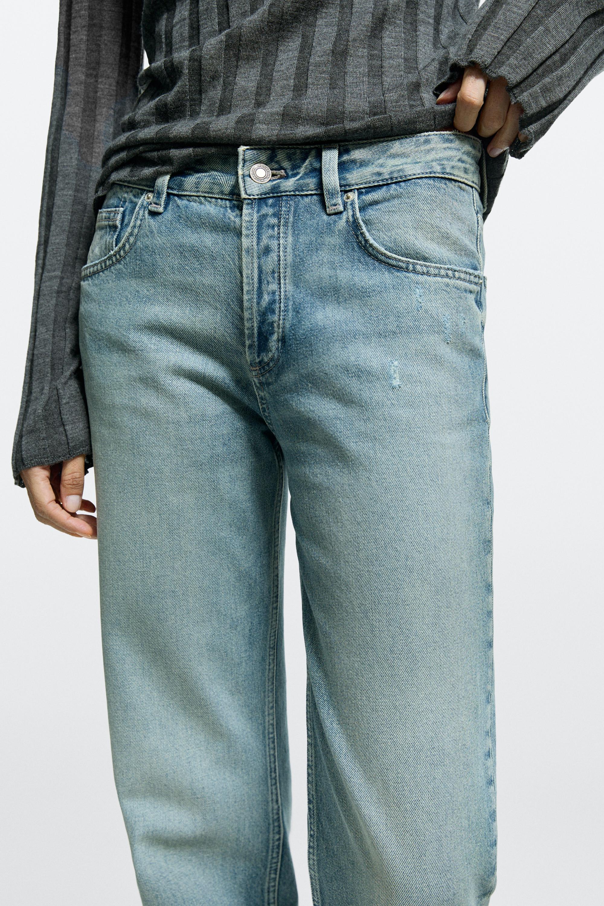 Mid-waist stovepipe jeans with frayed hems