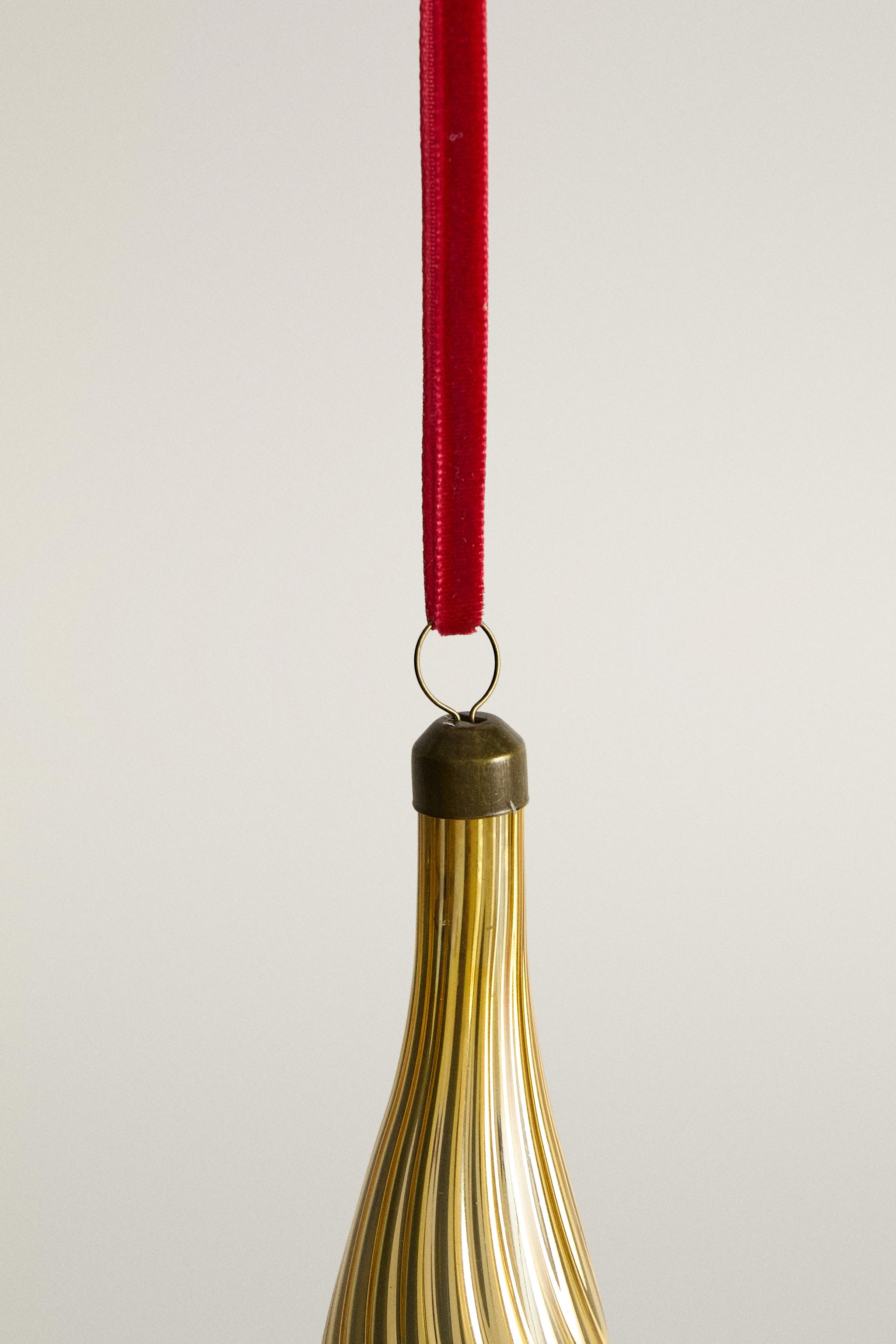 Décoration de sapin Noël allongée dorée
