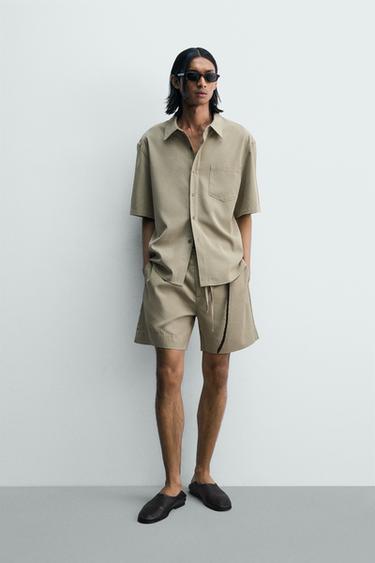 FADED-EFFECT RELAXED FIT BERMUDA SHORTS - Beige by Zara