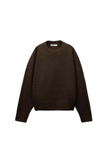 Front view of a dark brown jumper with a crew neck and long sleeves.