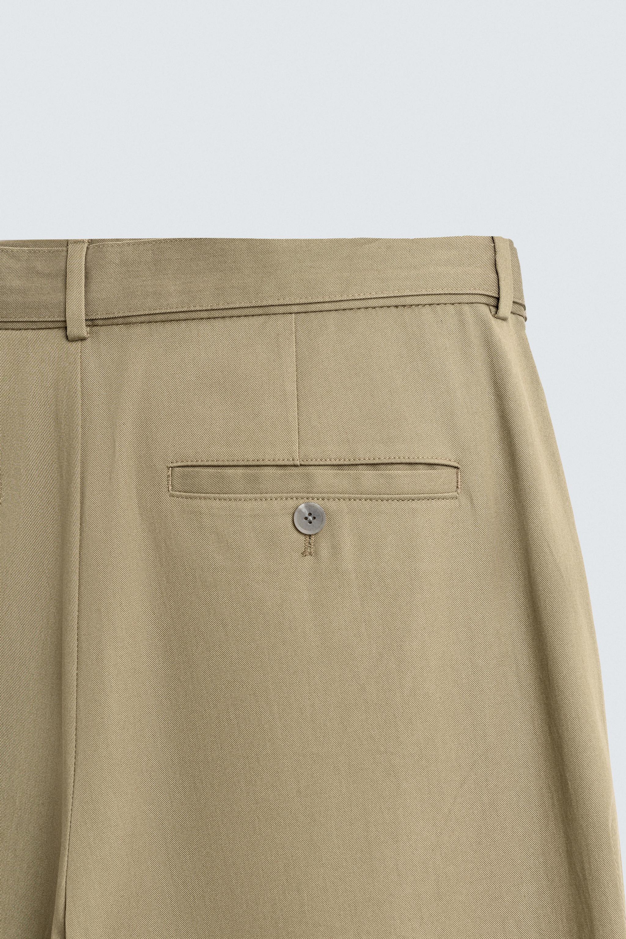 FLOWY PLEATED BELTED PANTS