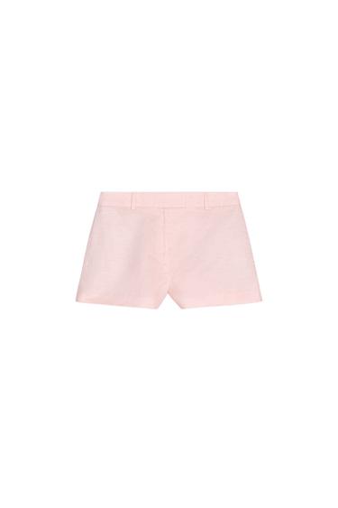 Rear view of pink shorts with belt loops.