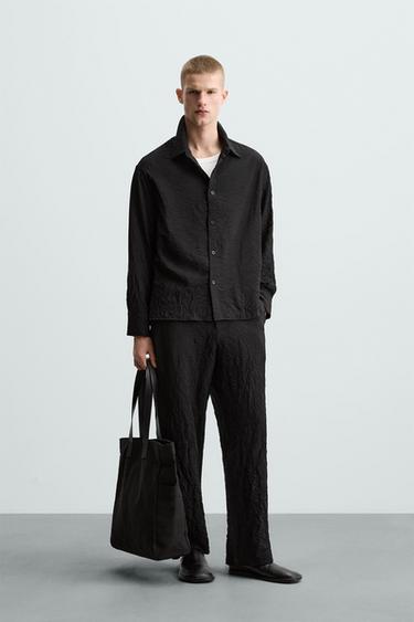 PANTALÓN EFECTO ARRUGADO - Negro de Zara - Imagen 0