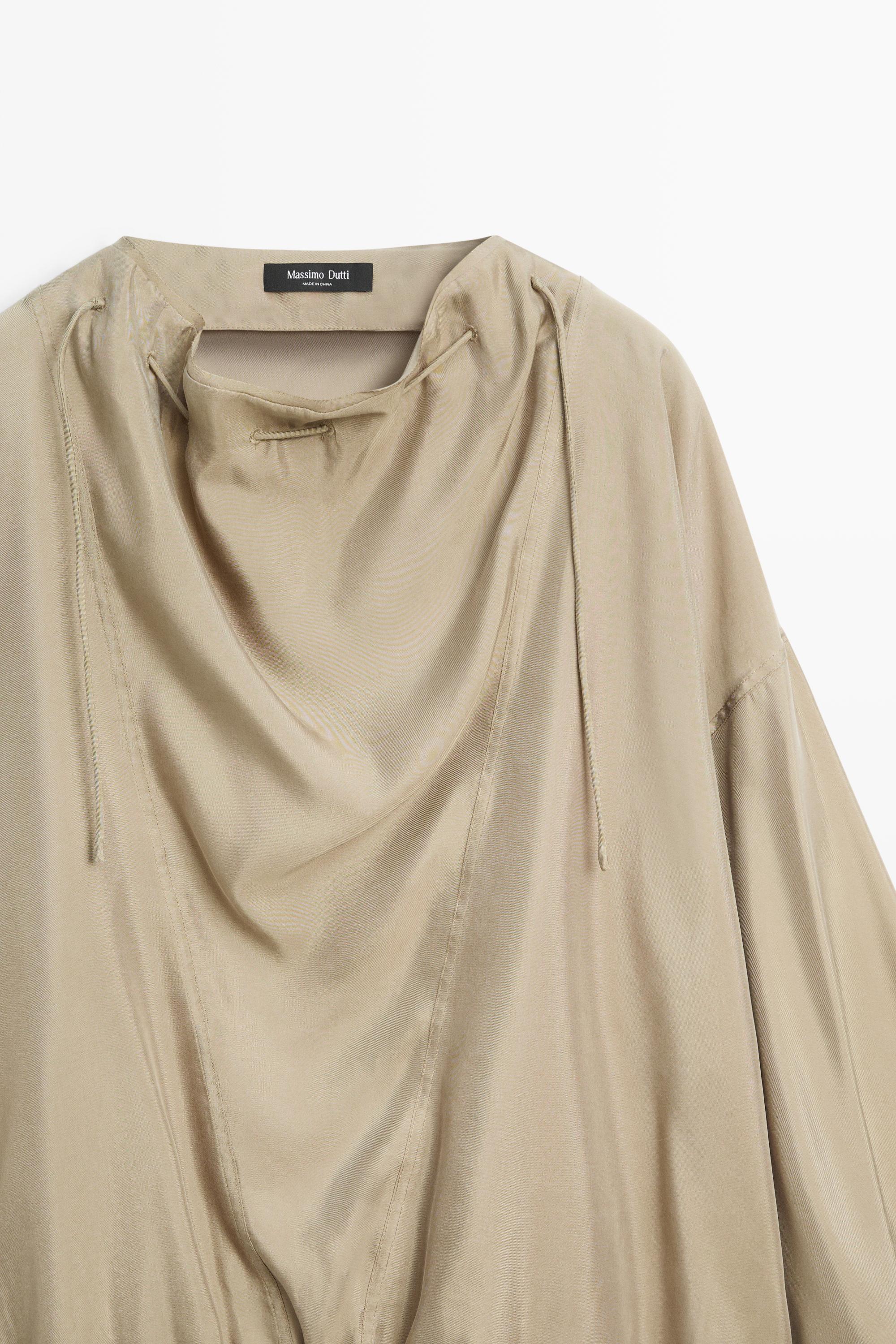 Blouse fluide à cordon au col