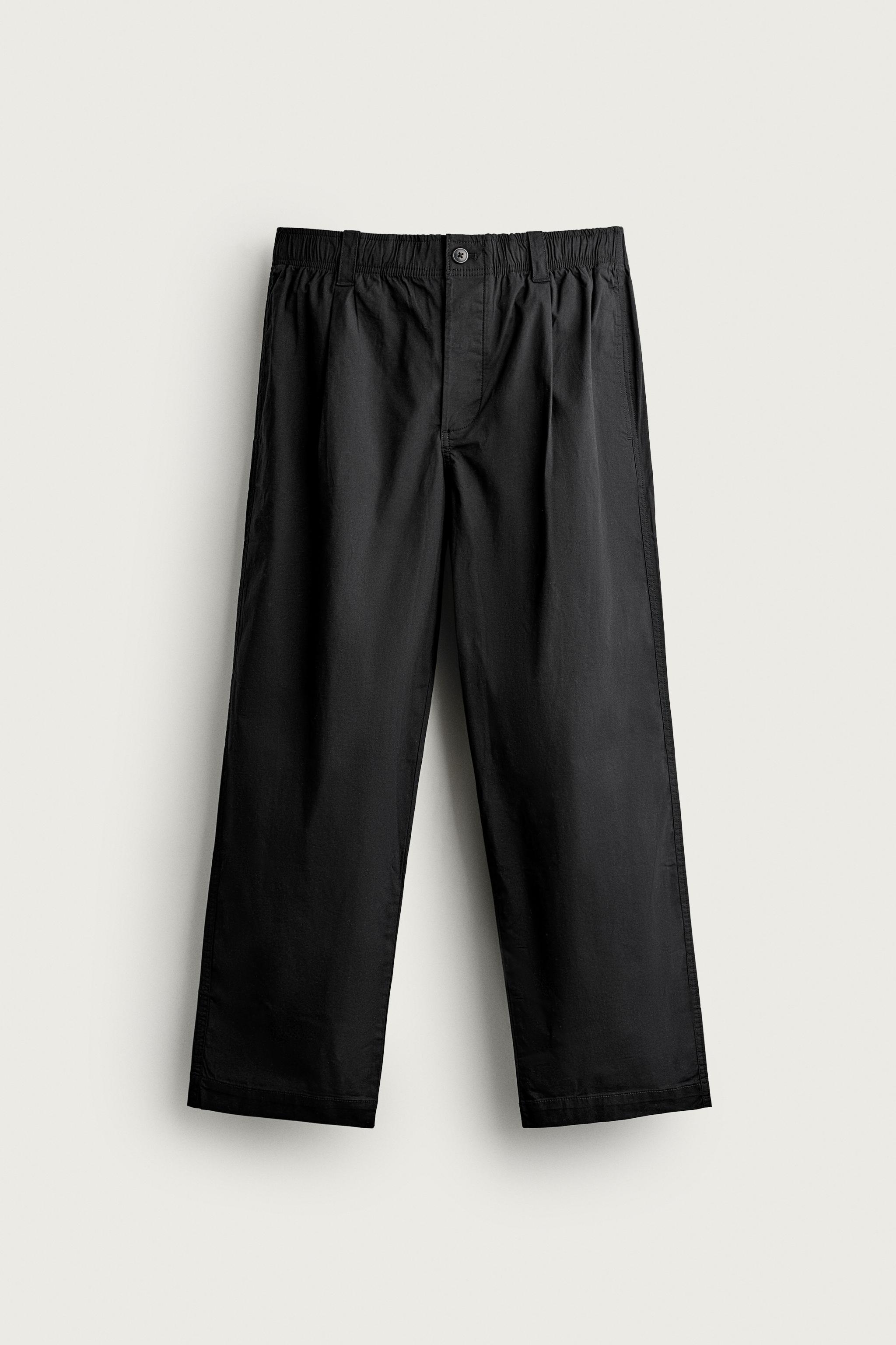 PLEATED RELAXED-FIT PANTS — Black