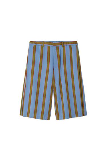 Light blue shorts with vertical brown and red stripes on a white background.