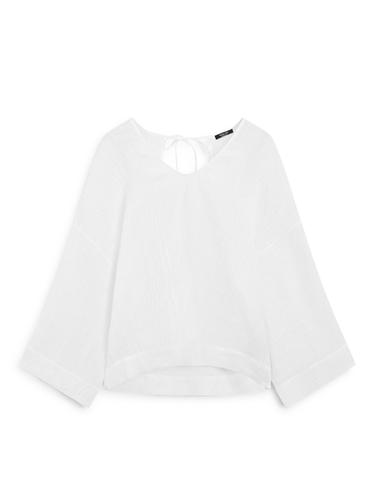 Blusa fluida gofrado 100% lino - Blanco roto de Zara