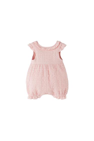 TEXTURED ROMPER WITH RUFFLE TRIMS