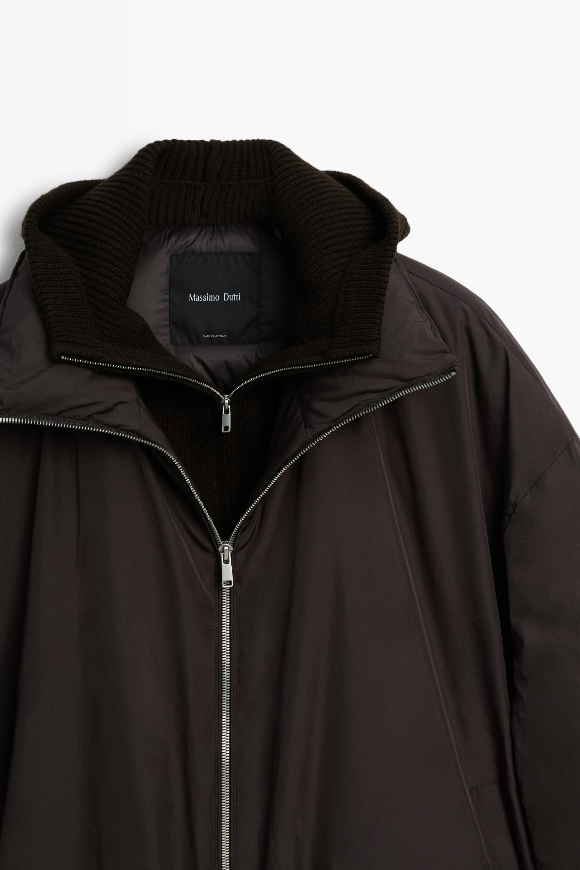 Down jacket with detachable detail piece