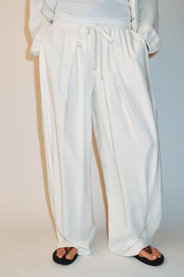 PANTALÓN FLUIDO BAJO AJUSTABLE SET - Blanco roto de Zara