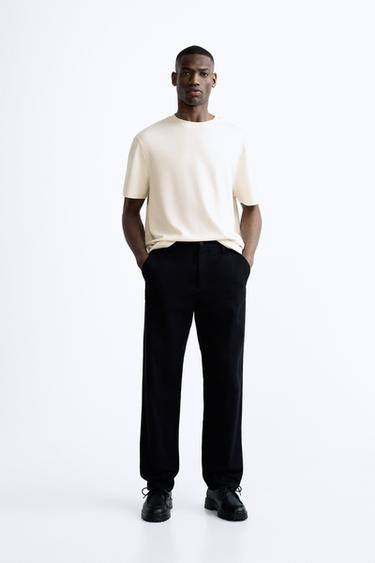 تيشرت هيكلي بجاكار - أبيض مكسور الخاص بـ Zara