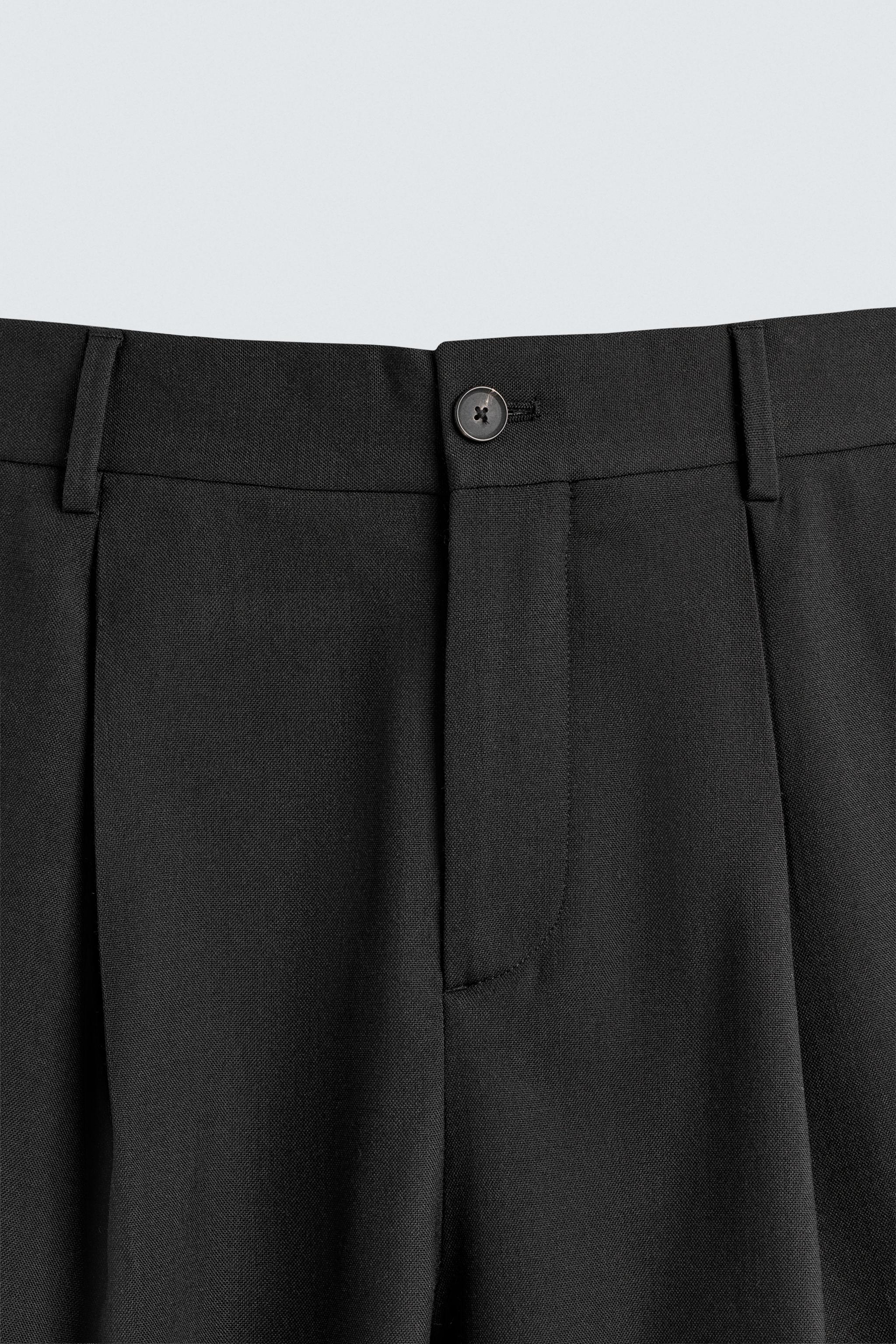 PANTALON RELAXED FIT À PLIS