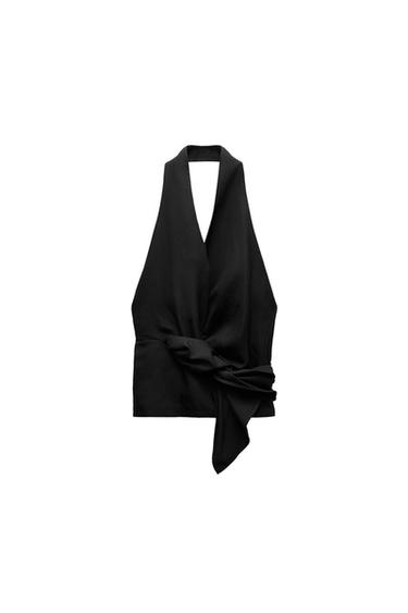 Front view of a black top featuring a halter neckline and knot detail at the waist.